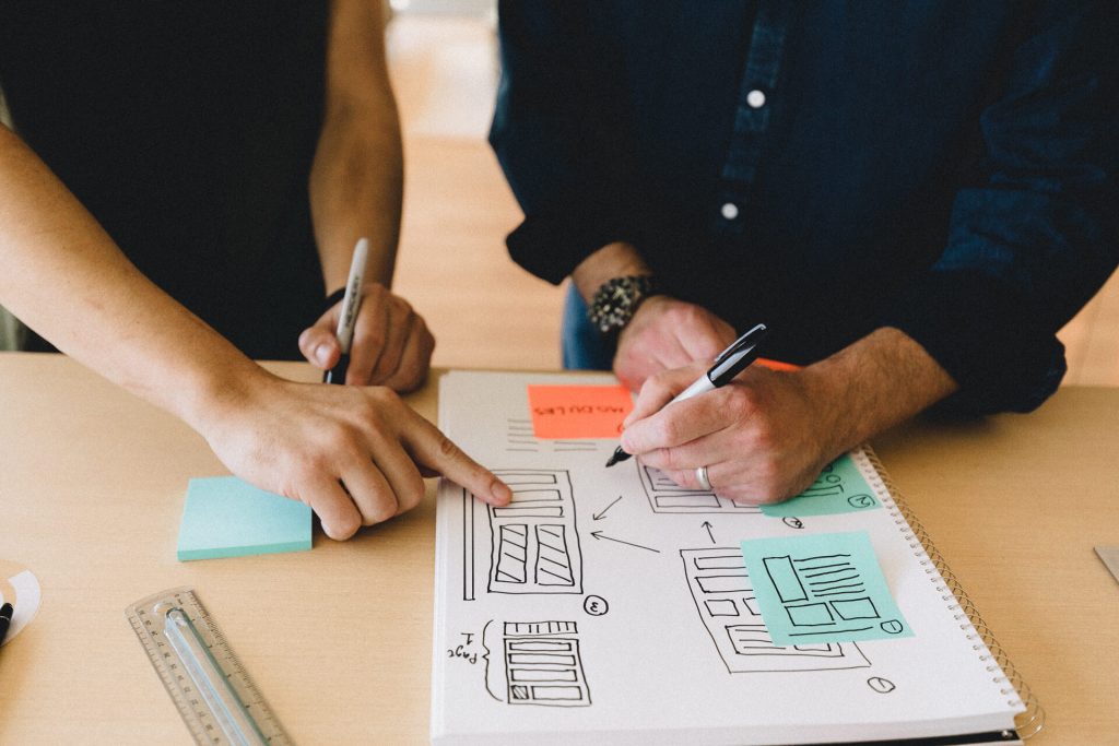 Two people comparing notes and ideas