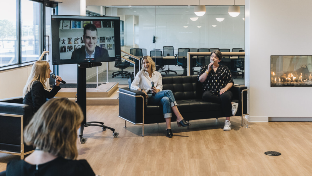People sitting in lounge having conversation