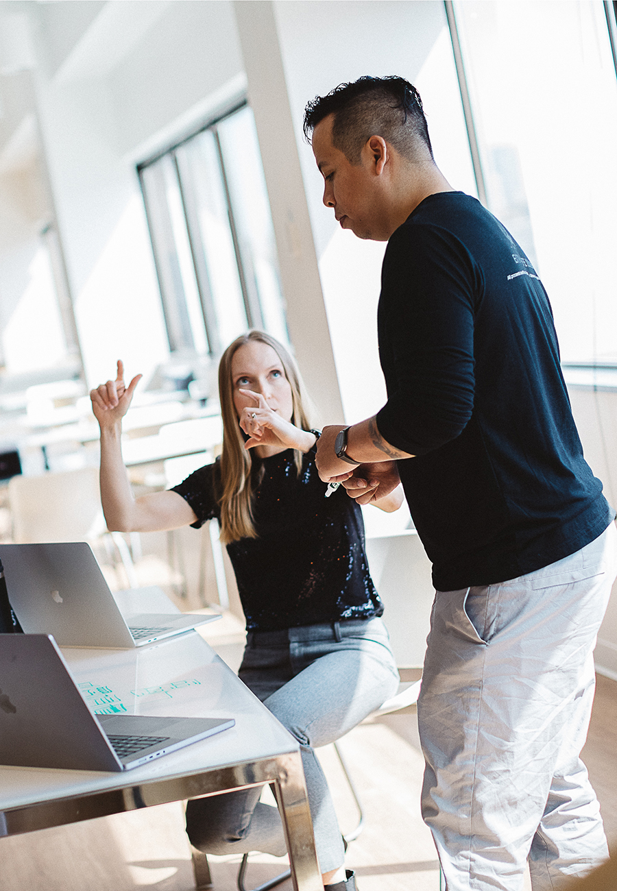 Woman and a man in an office brainstorming together