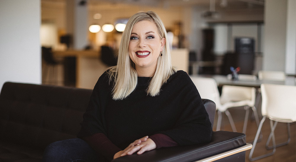 Image of Rachel Alm Nedery's VP of People Operations sitting in the Nerdery common space